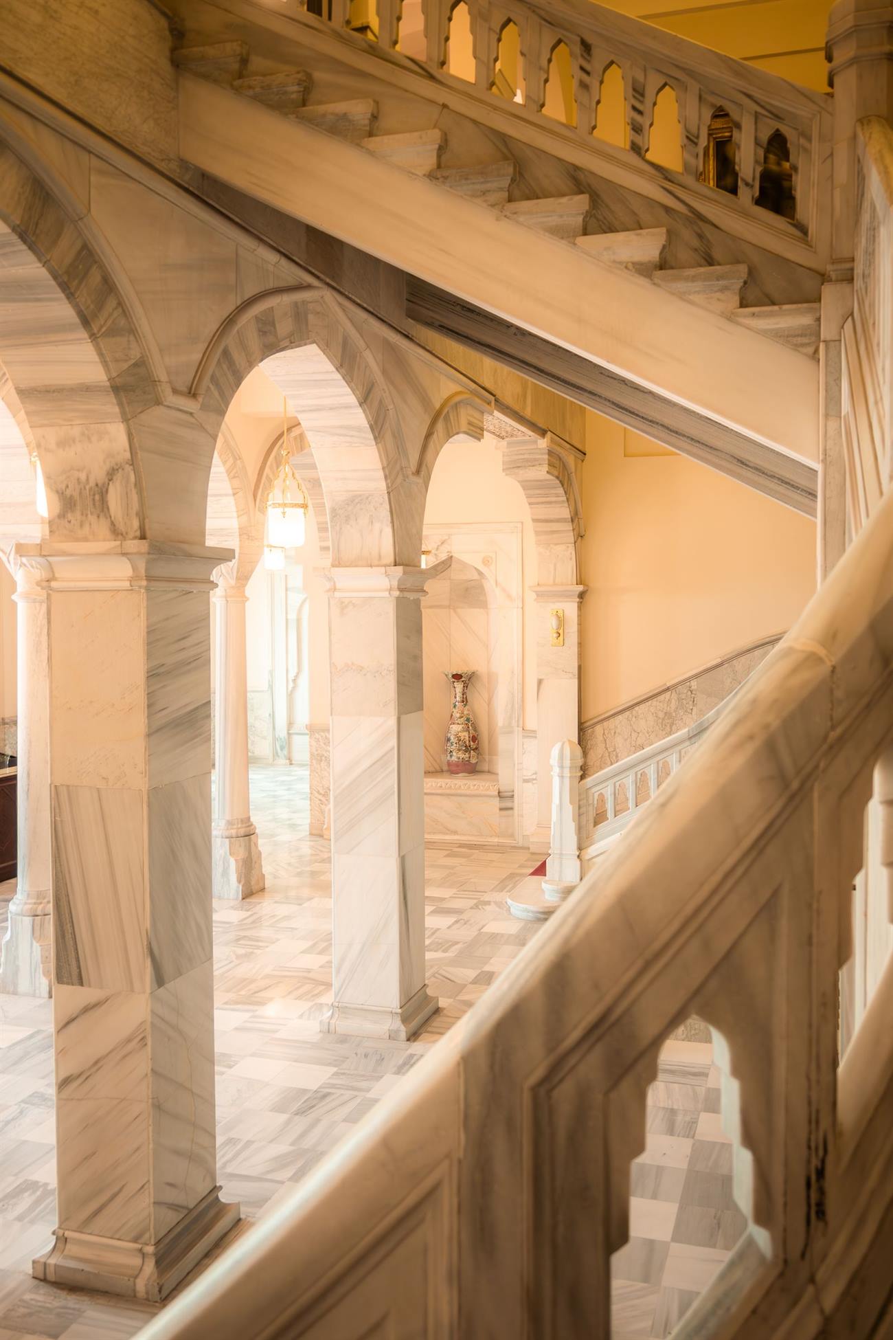 Marble staircase with arches in warm light
